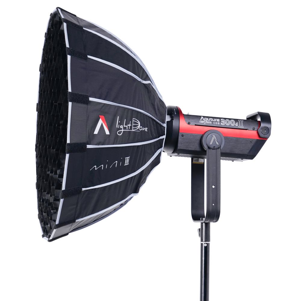 Aputure Light Dome Mini III with a fabric control grid attached to a 300d CoB Light.