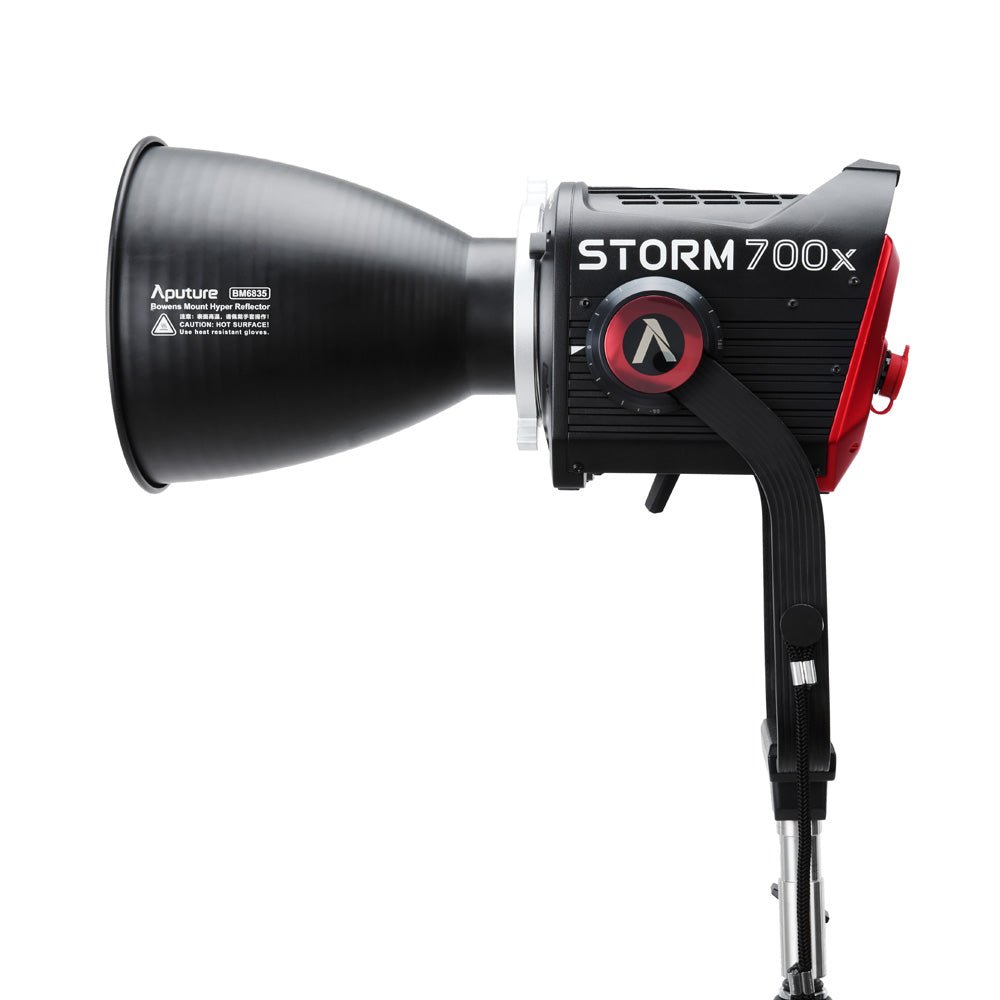 Side view of Aputure STORM 700x with reflector connected.