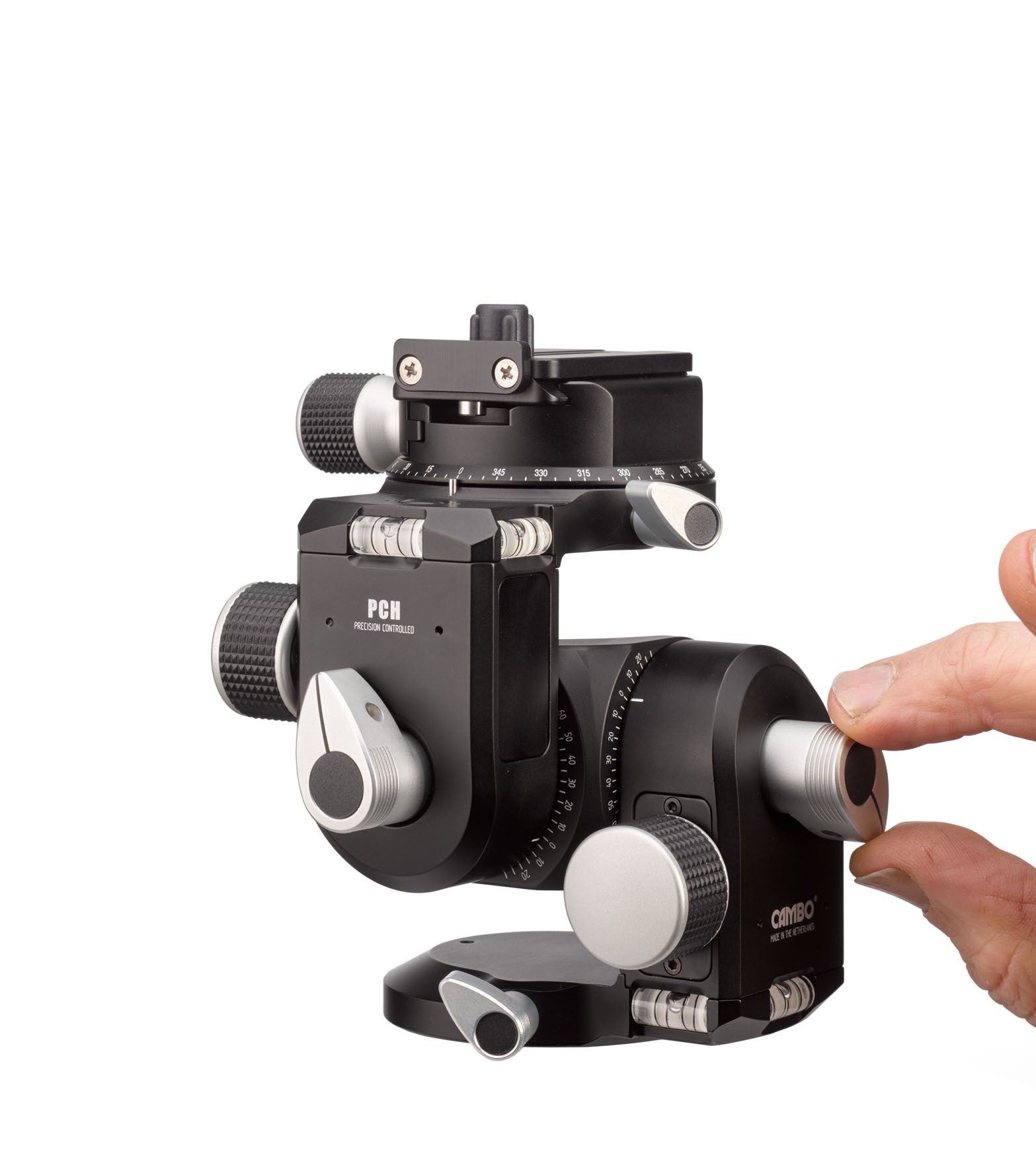 Detailed image of the Cambo PCH Precision Controlled Geared Head with a hand in the image for scale. 