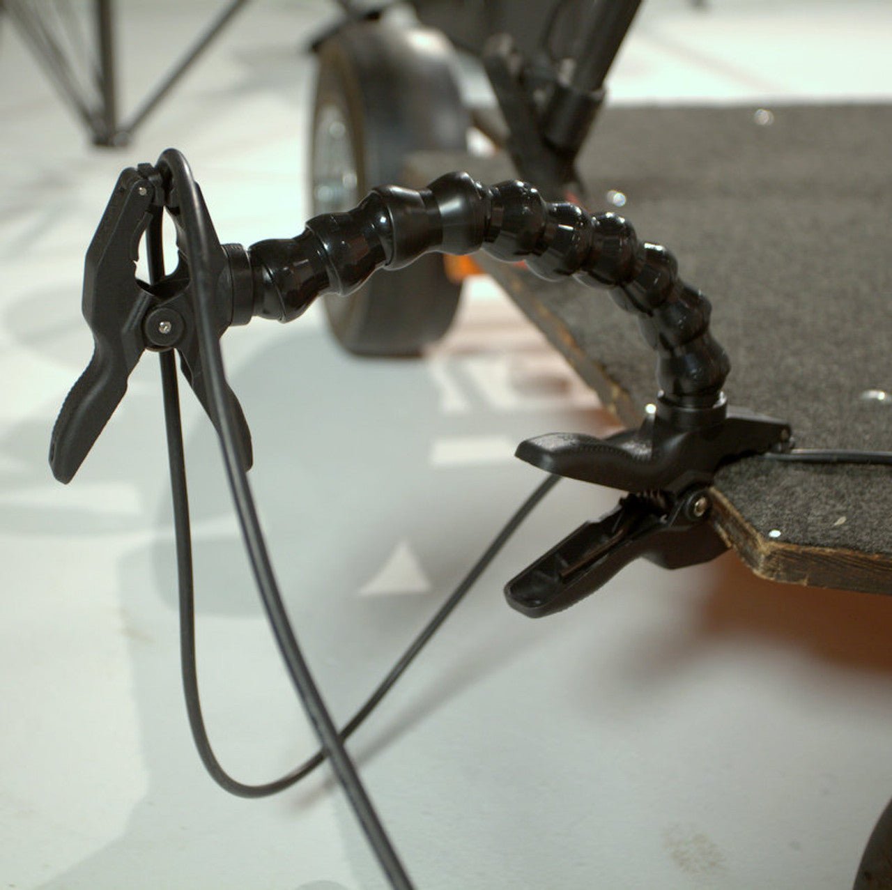 Dinkum Clamp to Clamp (1" to 2") connected to a platform and a cable.