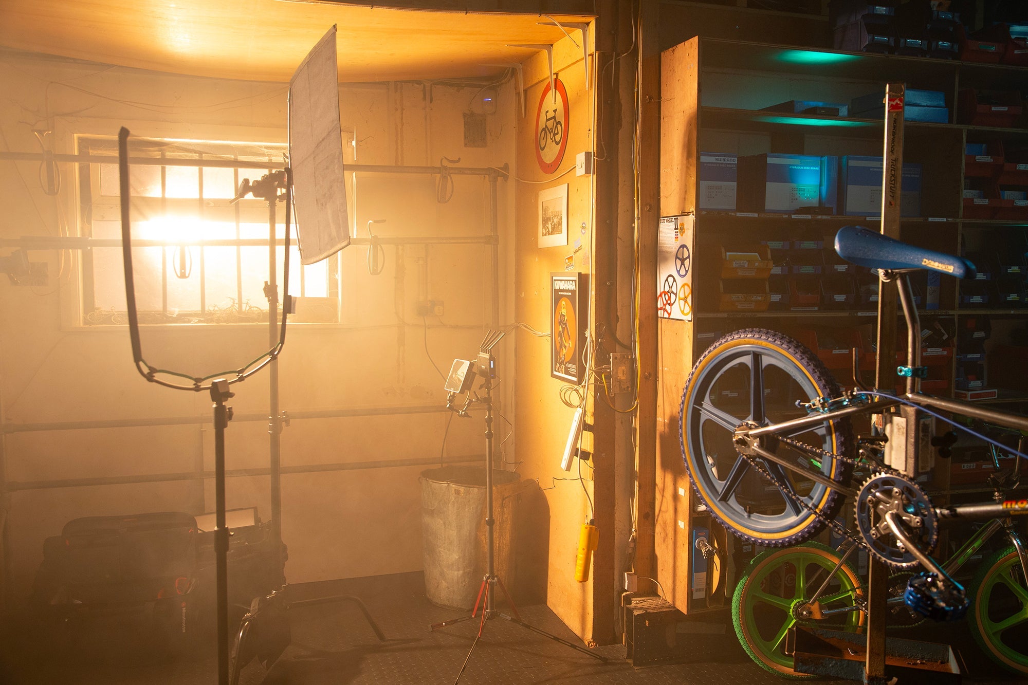 Inside a bike repair shop, showing the Rapid Flag frame and Single Scrim in the foreground.