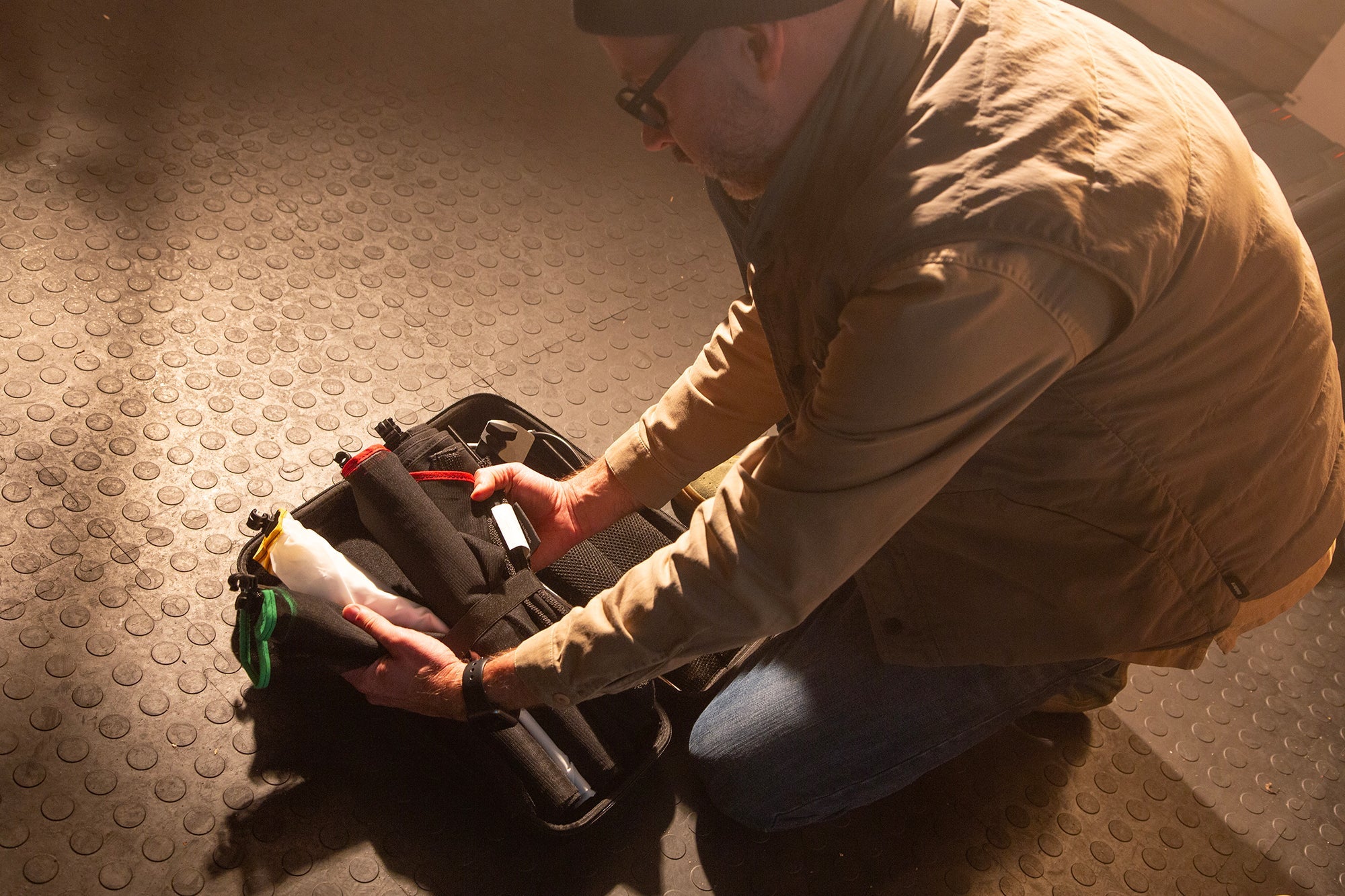 Lighting technician removing the Rapid Flag Kit form the Case. 