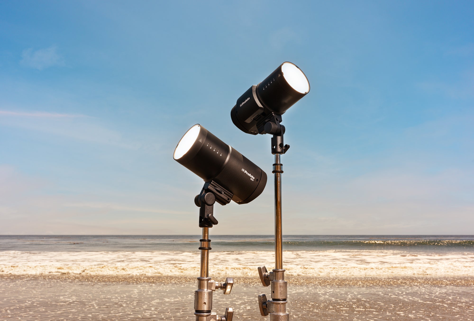 Profoto B20 and B30 shown on a beach environment, on C-Stands.