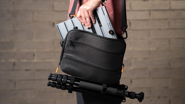 A person with the Tether Tools AeroTrac Carrying Case.