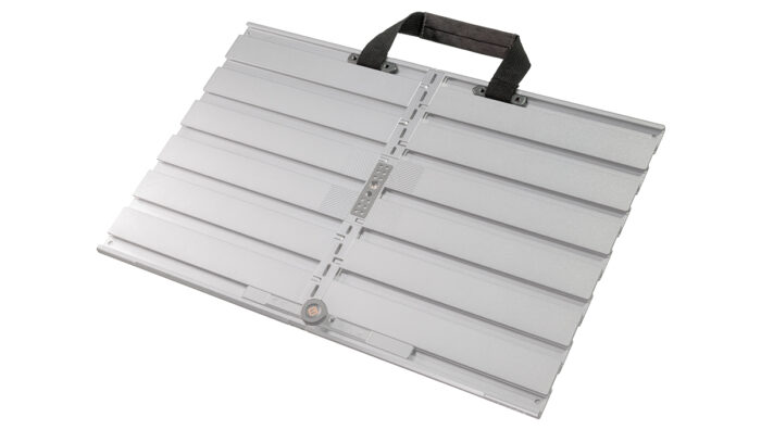 A person utilising the Tether Tools AeroTrac Handle on the workstation.