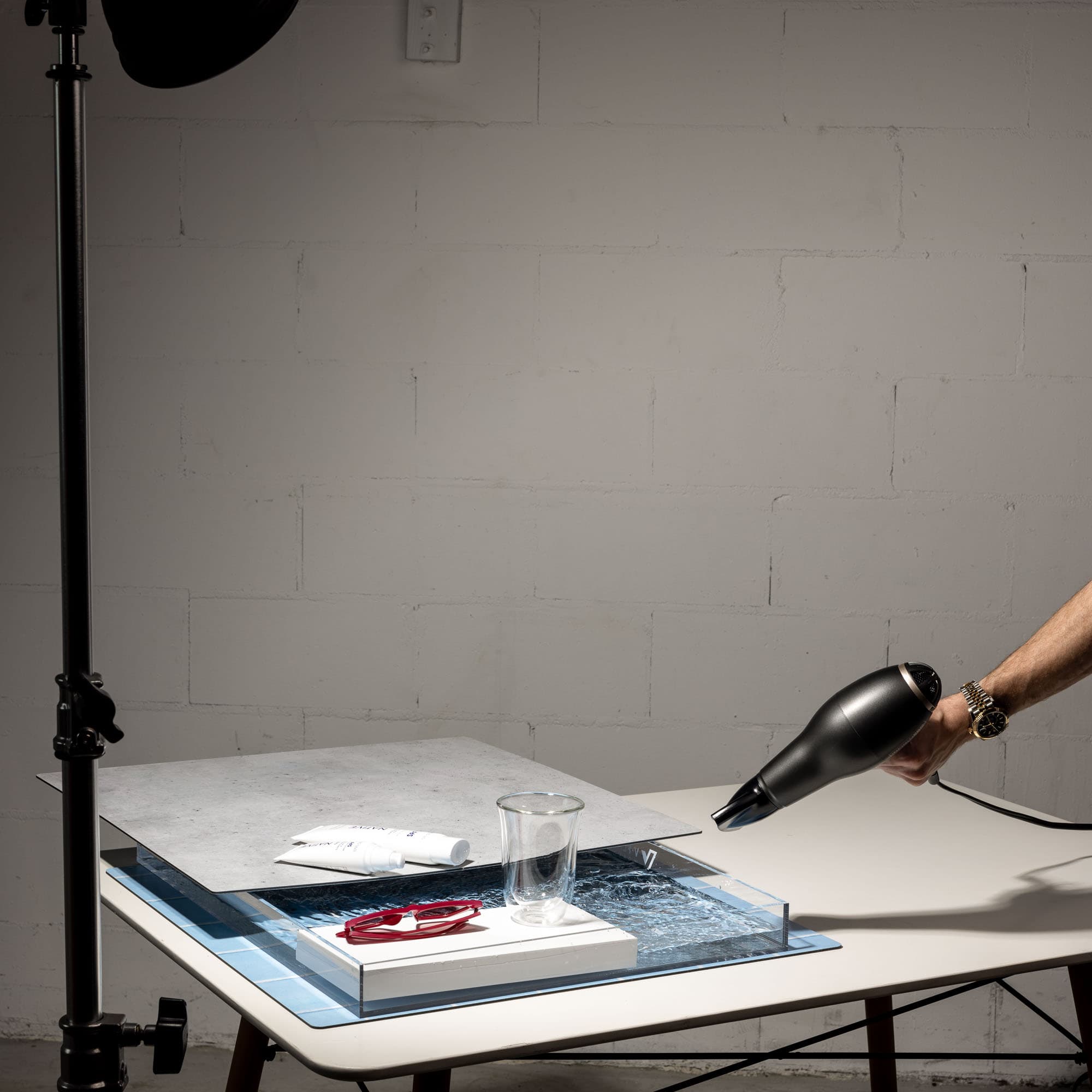 A hairdryer emphasising the water effect in the V-Flat Aqua Tray (24"x19").