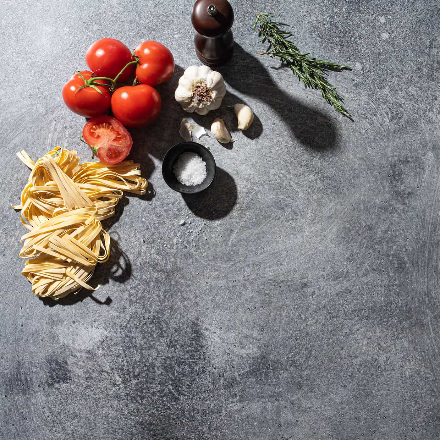 V-Flat Grey Chalk/Dark Chalk Duo Board with fresh ingredients photographed from a birds eye view.