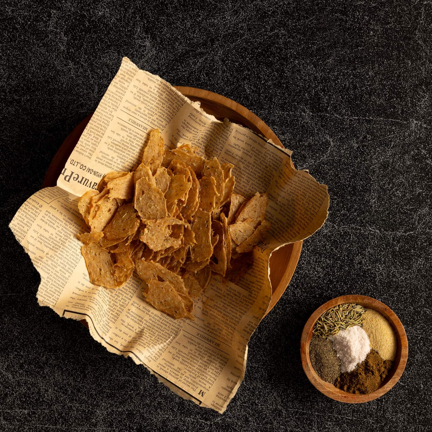 V-Flat Ocean Slate/Black Slate Duo Board being used with a bowl of crisps.