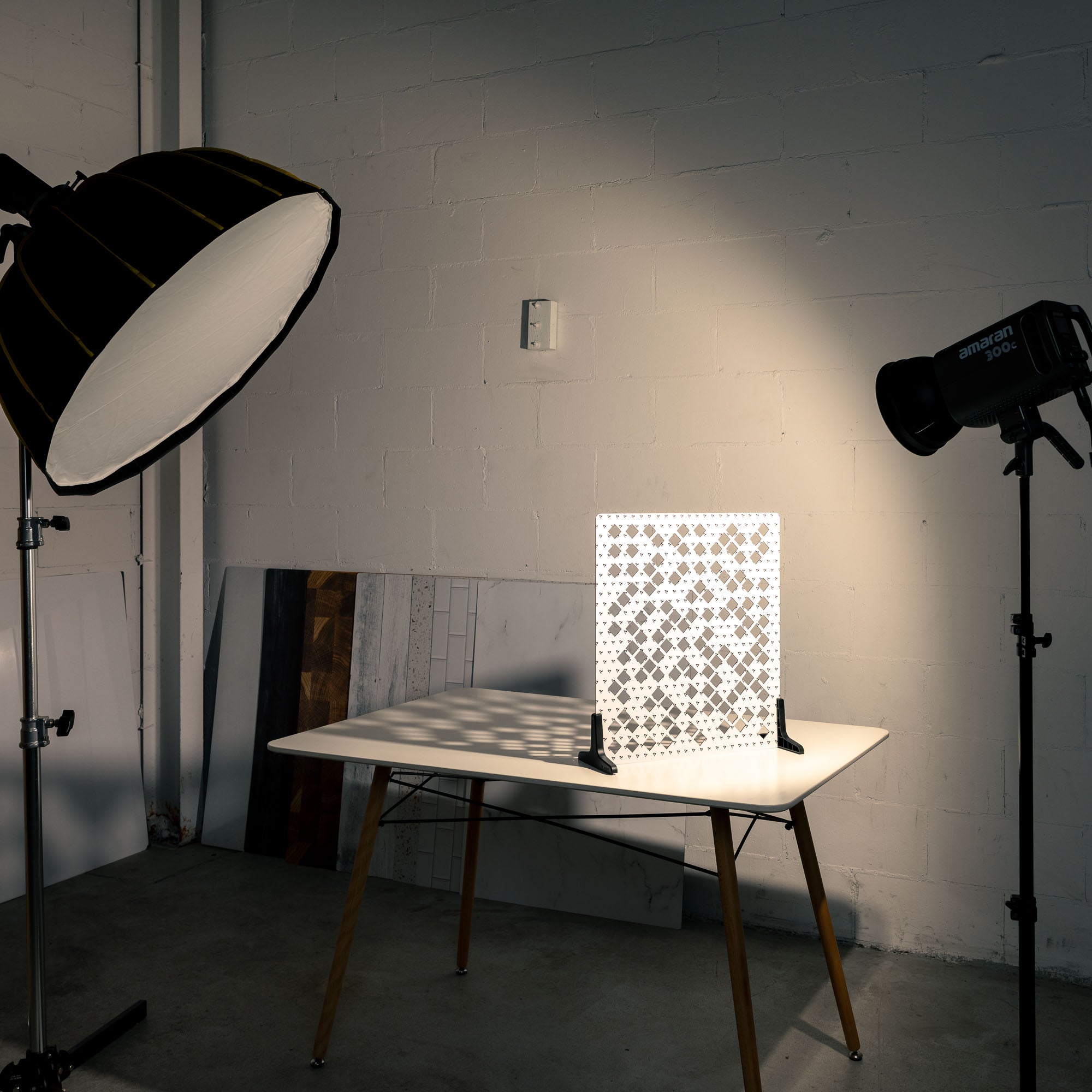 V-Flat 'Scattered Diamonds' Shadow Board BTS image with a spotlight projecting light through.