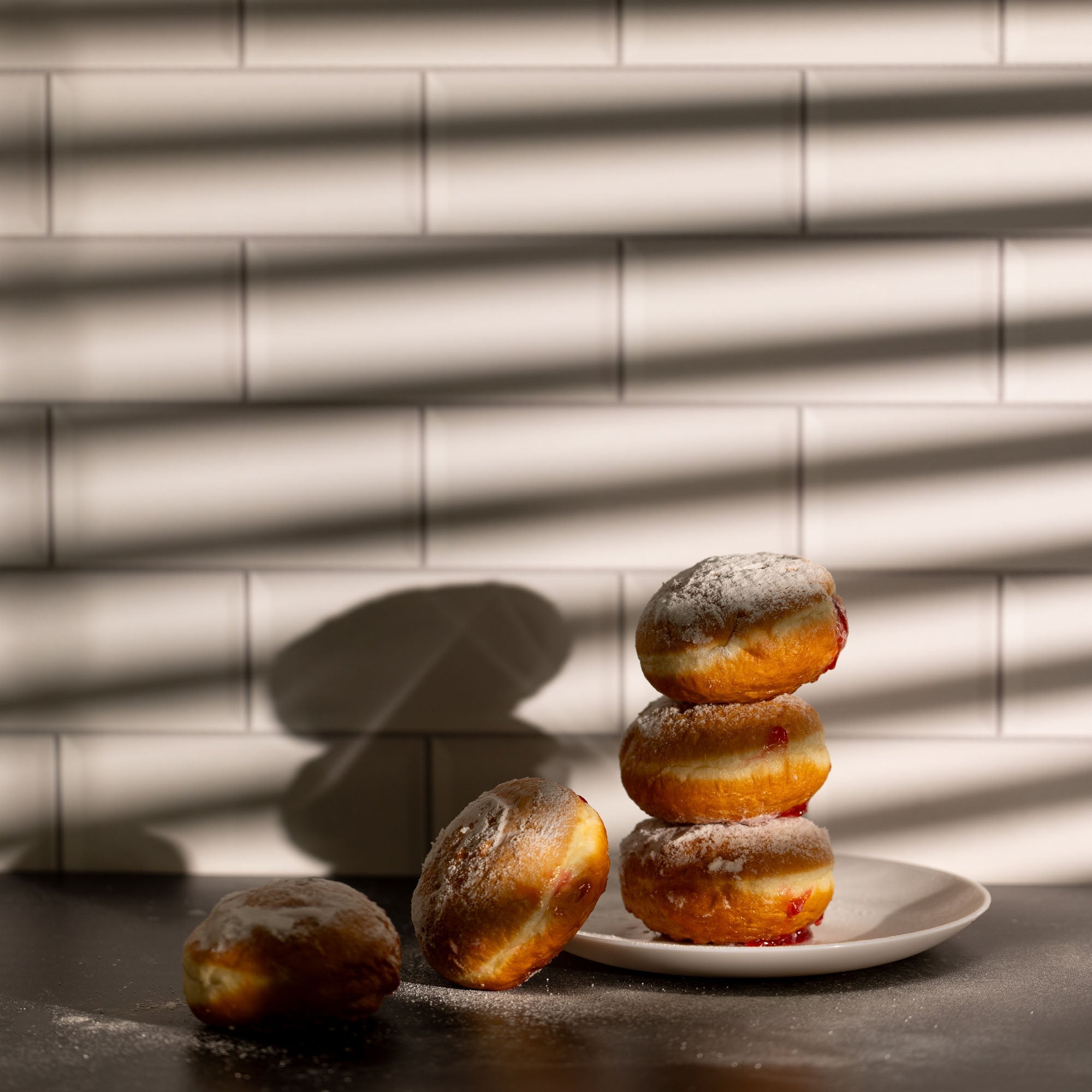 A stack of donuts with the light controlled by V-Flat Window Blinds.