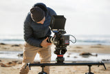 The Manfrotto Syrp Genie II Linear set up on a slider on a beach