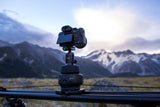 The Manfrotto Syrp Genie II Linear set up on a slider in the countryside