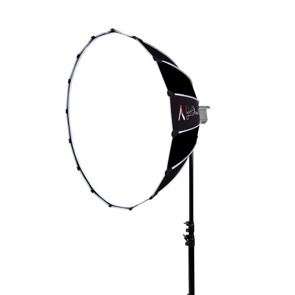 Softbox on a lighting stand with an LED CoB light attached shot on a white background.