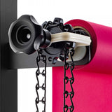 Manfrotto Expan Background Paper Holder Drive with black metal chain (046MCB) shown set up with a paper roll