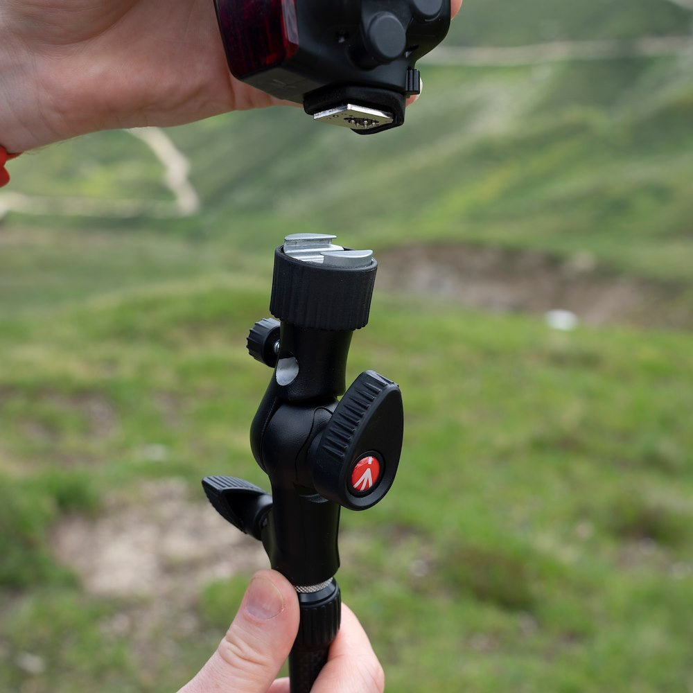 Manfrotto Cold Shoe Tilt Head being attached to a flash