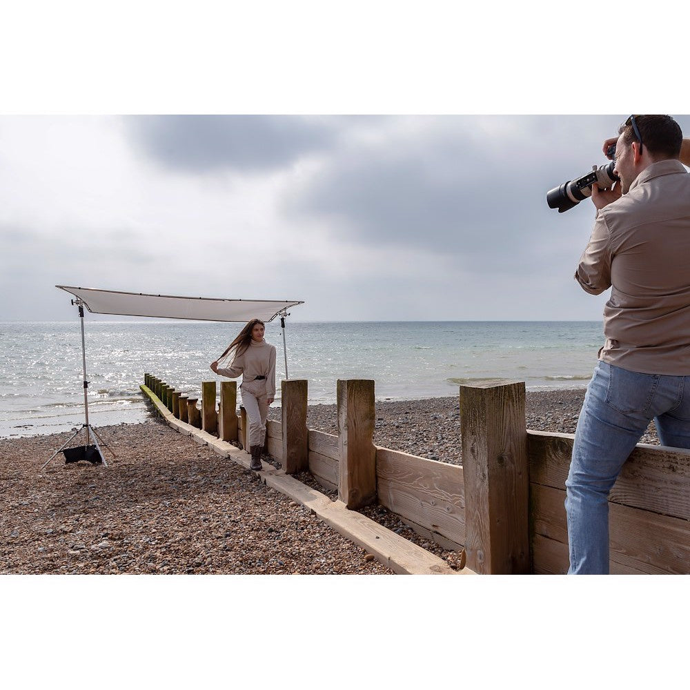 Manfrotto Pro Scrim 2.9m x 2.9m Extra Large, With Black Screen in use on a beach
