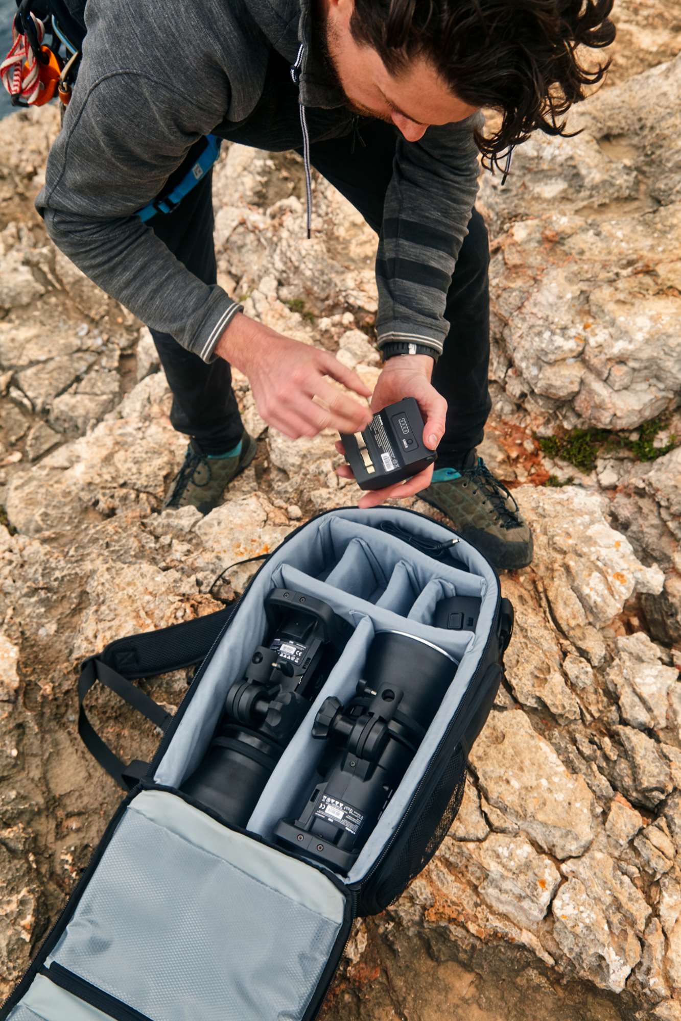 Profoto OCF Zoom Reflector being unpacked on a coastal location shoot 