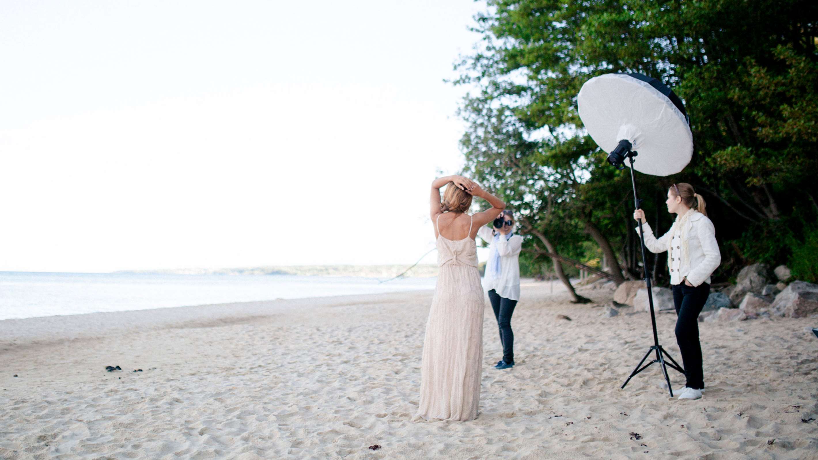 Umbrella with a diffuser being used on a location shoot