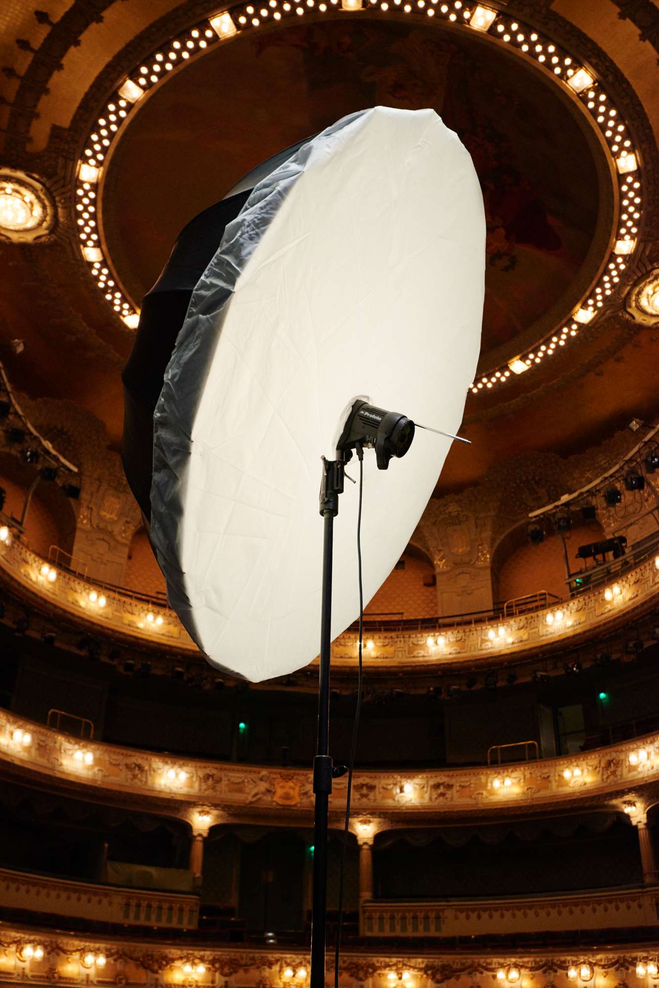 Umbrella with a diffuser being used on a location shoot