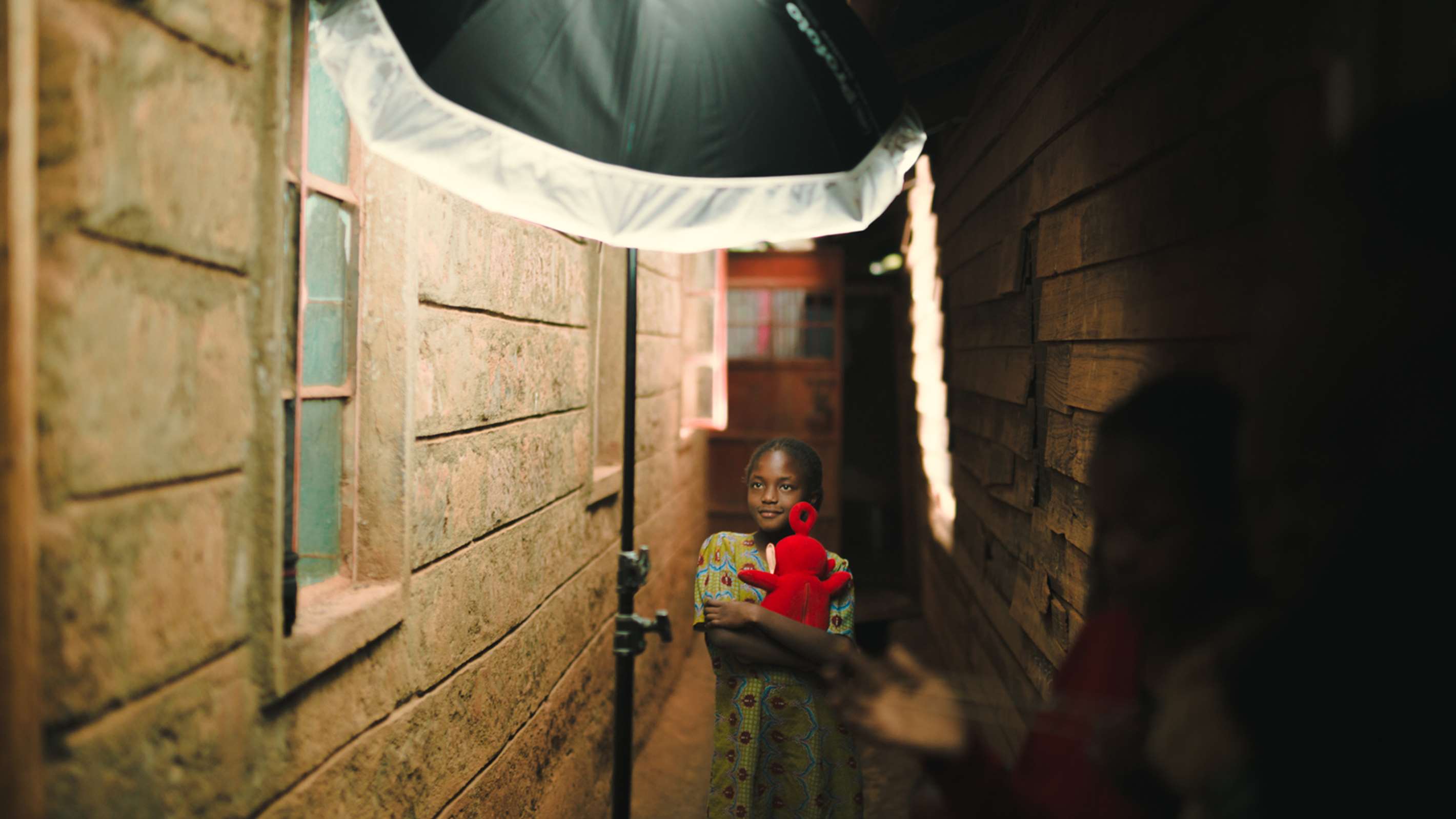 Umbrella with a diffuser being used on a location shoot