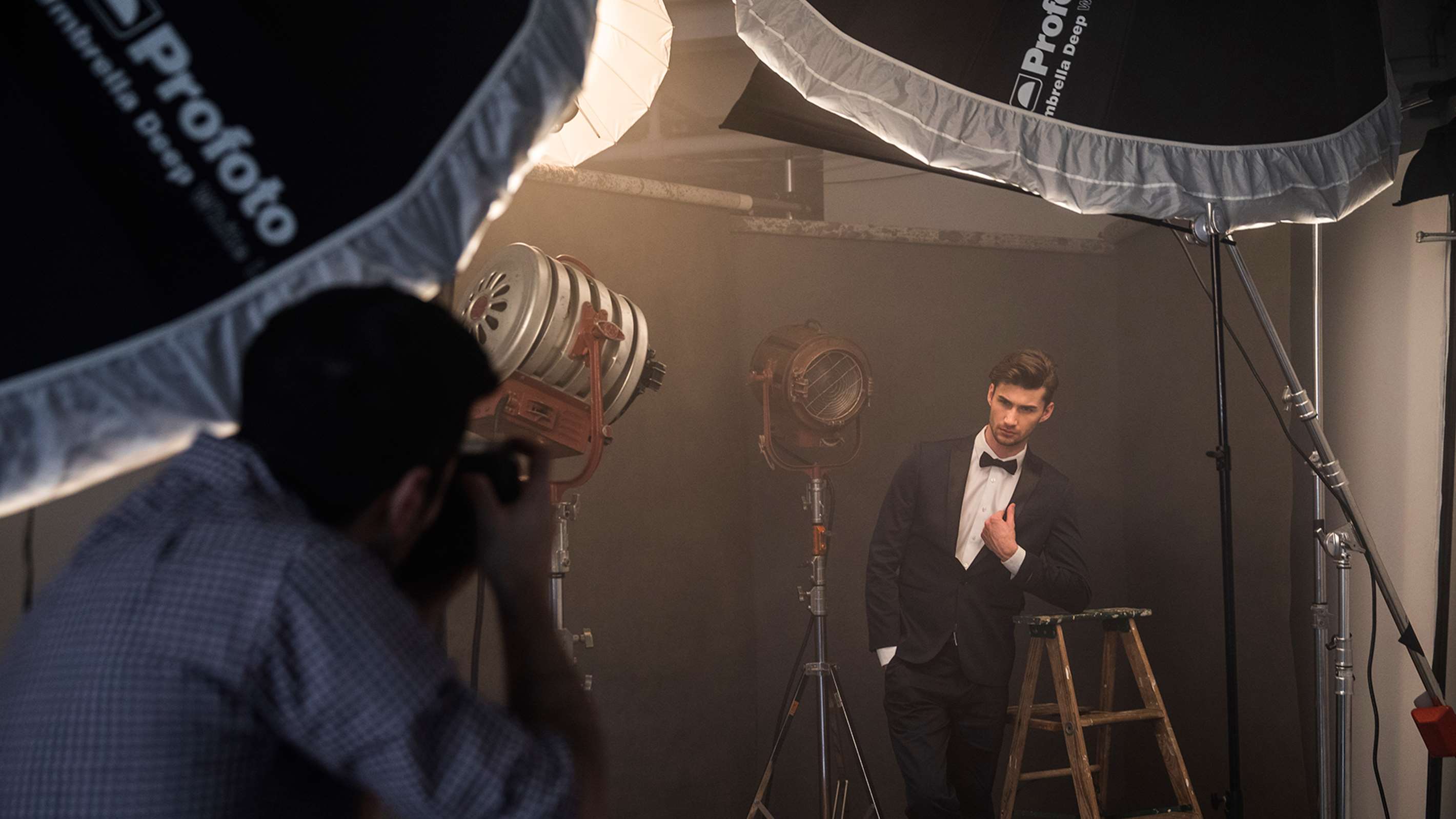 Sexy Man Being Photographed, Optional Profoto Large Umbrella Diffuser On Set, In Use With Fashion Model